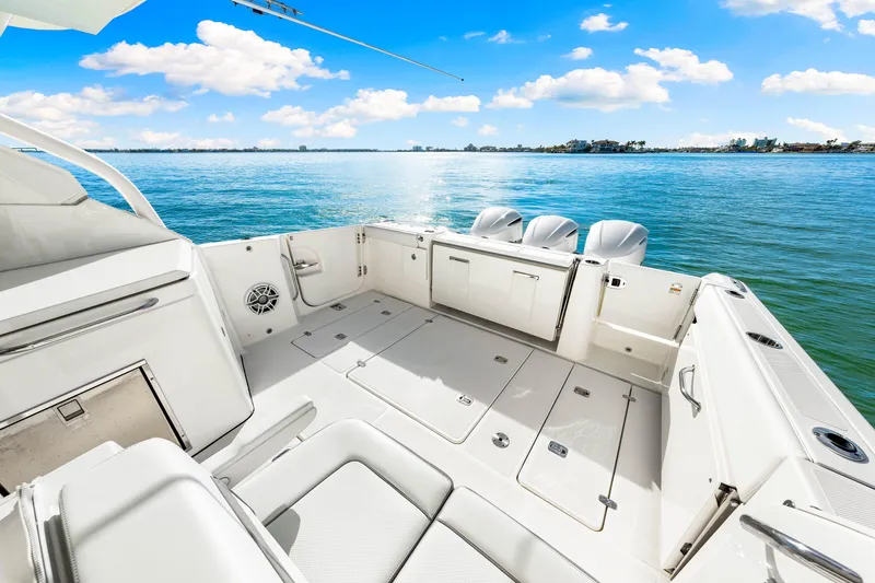 Conspirasea Yacht Photos Pics 2021 Pursuit DC 365 Dual Console boat on serene blue water.