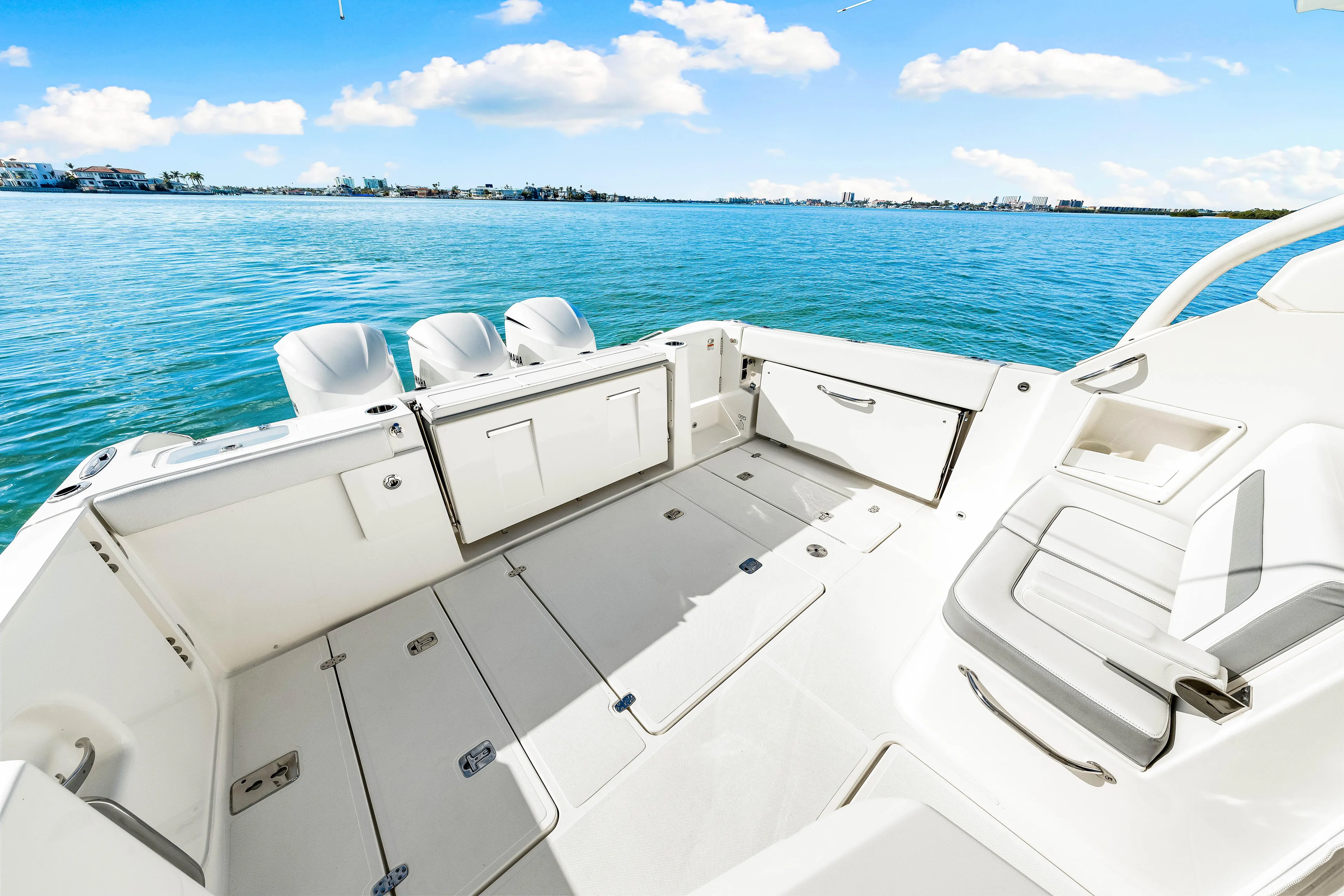 Conspirasea Yacht Photos Pics 2021 Pursuit DC 365 Dual Console boat interior with open deck and ocean view.