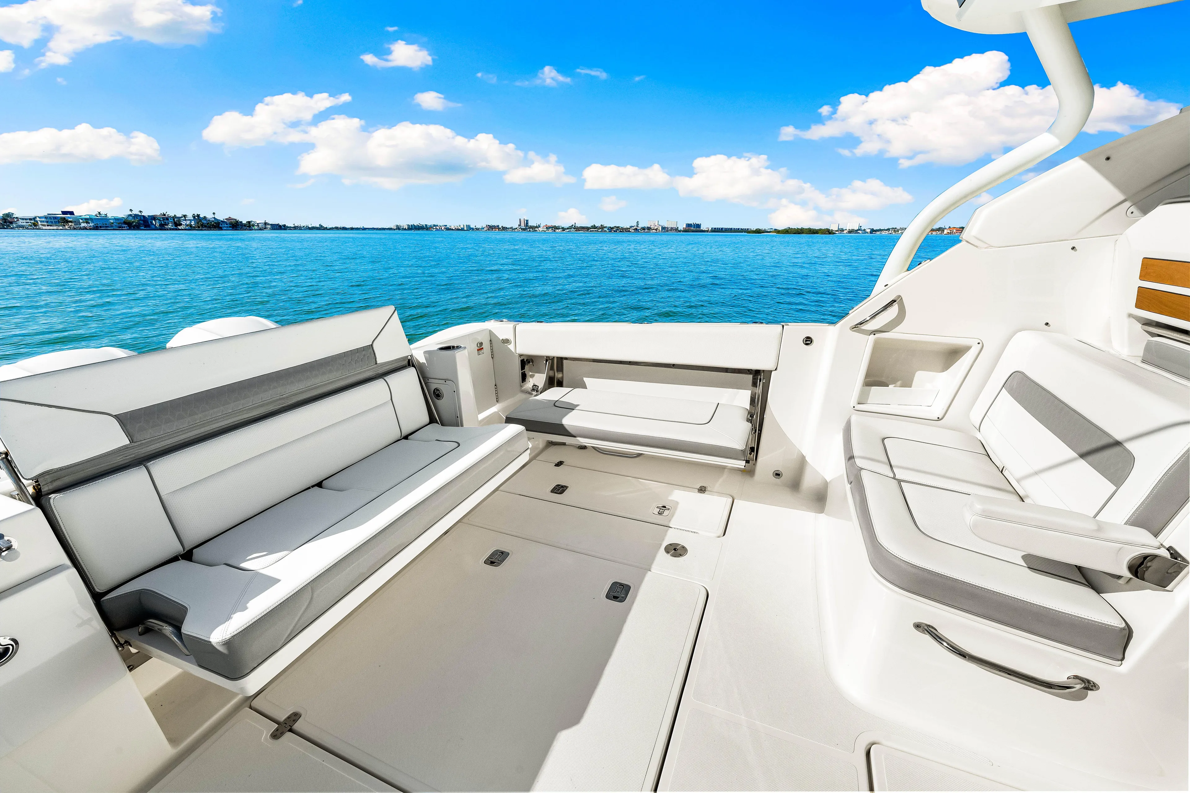 Conspirasea Yacht Photos Pics 2021 Pursuit DC 365 Dual Console boat interior with ocean view.