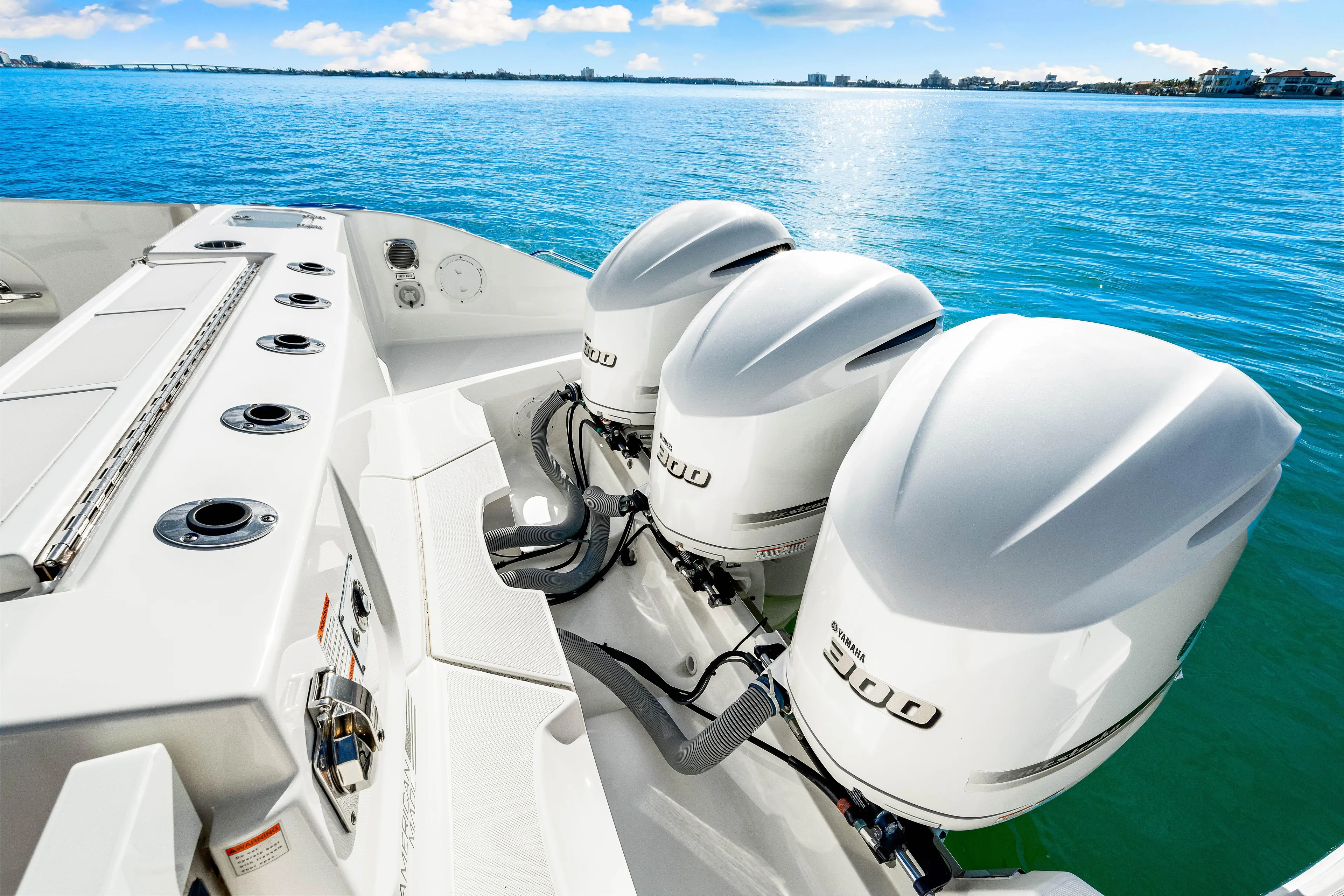 Conspirasea Yacht Photos Pics 2021 Pursuit DC 365 Dual Console boat with triple 300 horsepower engines on blue water.