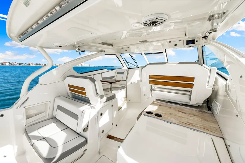 Conspirasea Yacht Photos Pics 2021 Pursuit DC 365 Dual Console boat interior with seating, ocean view, and modern design.