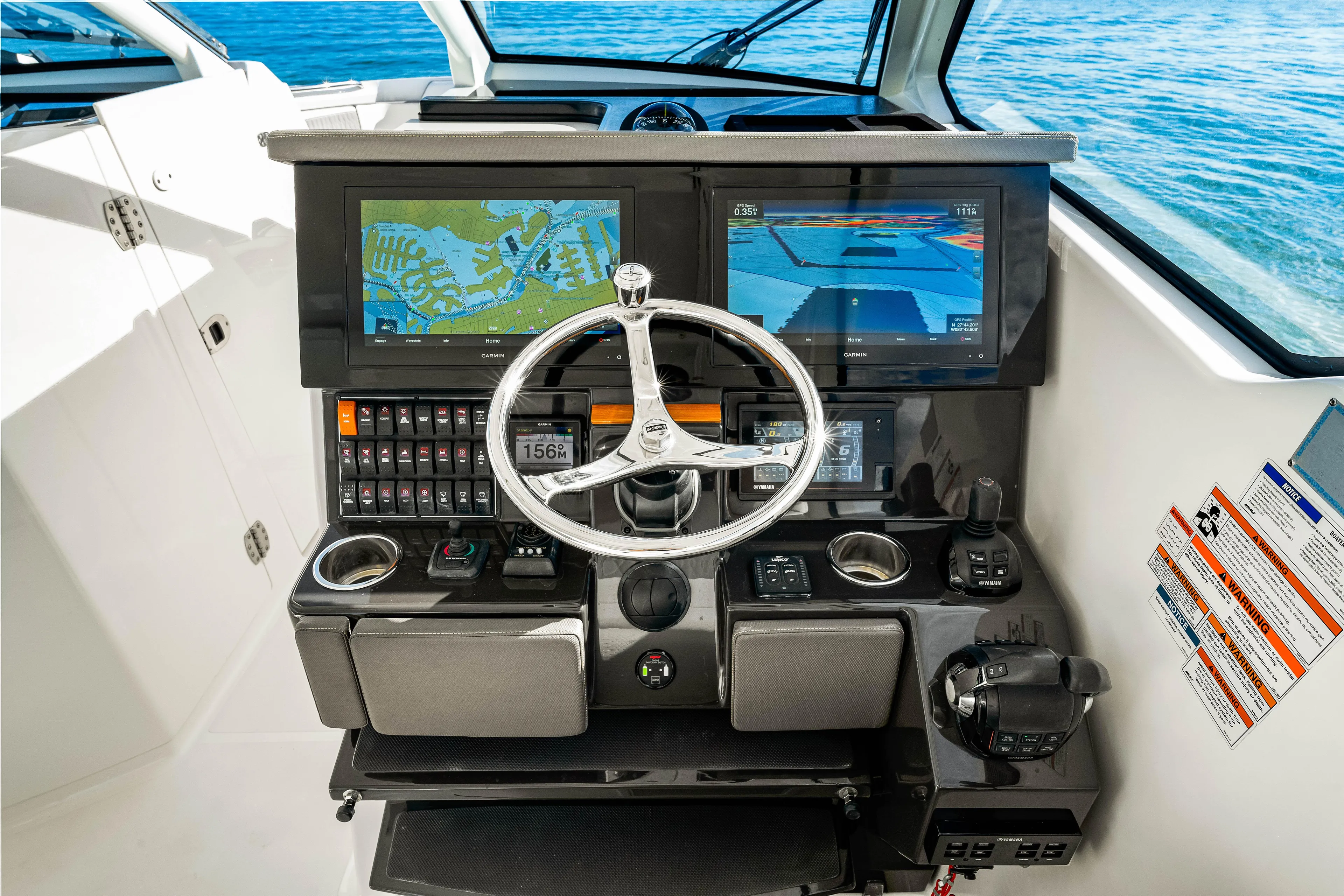 Conspirasea Yacht Photos Pics 2021 Pursuit DC 365 Dual Console helm with navigation screens and steering wheel.