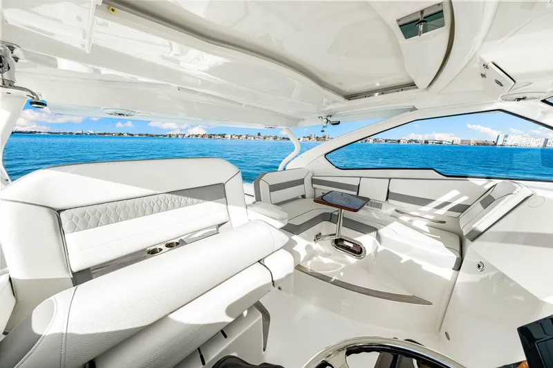 Conspirasea Yacht Photos Pics Luxurious interior of 2021 Pursuit DC 365 Dual Console boat on open water.