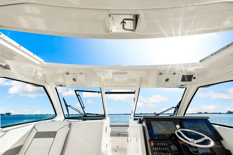 Conspirasea Yacht Photos Pics 2021 Pursuit DC 365 Dual Console boat interior with ocean view.