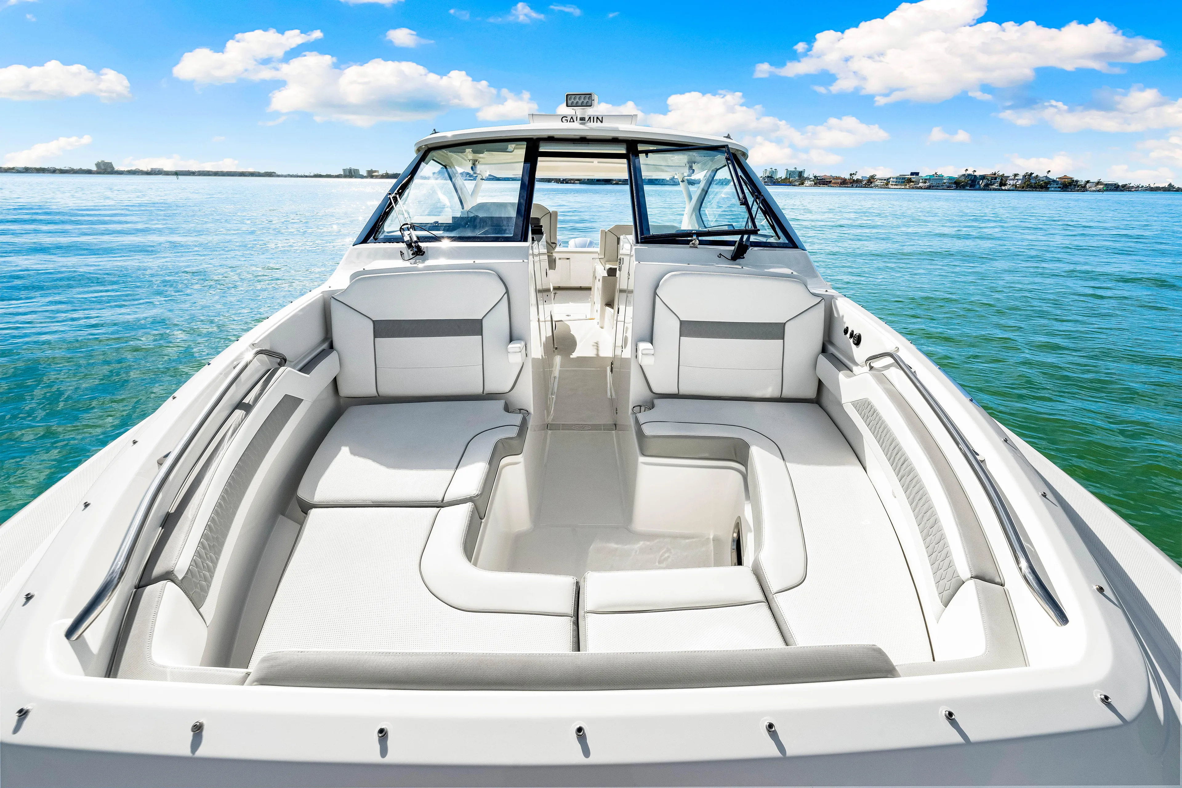 Conspirasea Yacht Photos Pics 2021 Pursuit DC 365 Dual Console boat on calm water, featuring spacious seating.