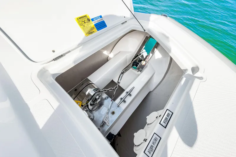 Conspirasea Yacht Photos Pics 2021 Pursuit DC 365 Dual Console anchor compartment with chain and winch.