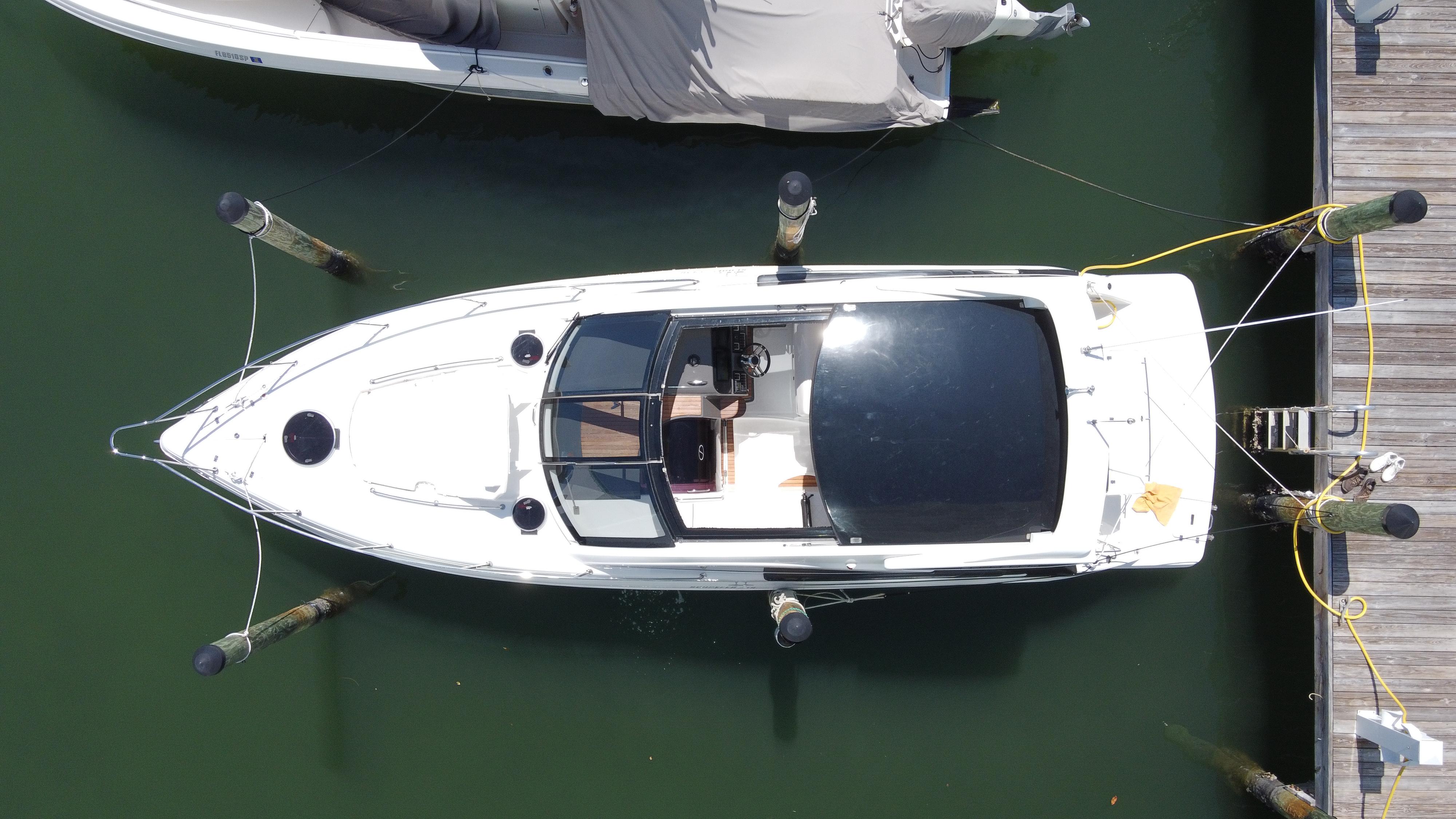 Overhead view of a 2023 Schaefer 375 HT boat docked at a marina.
