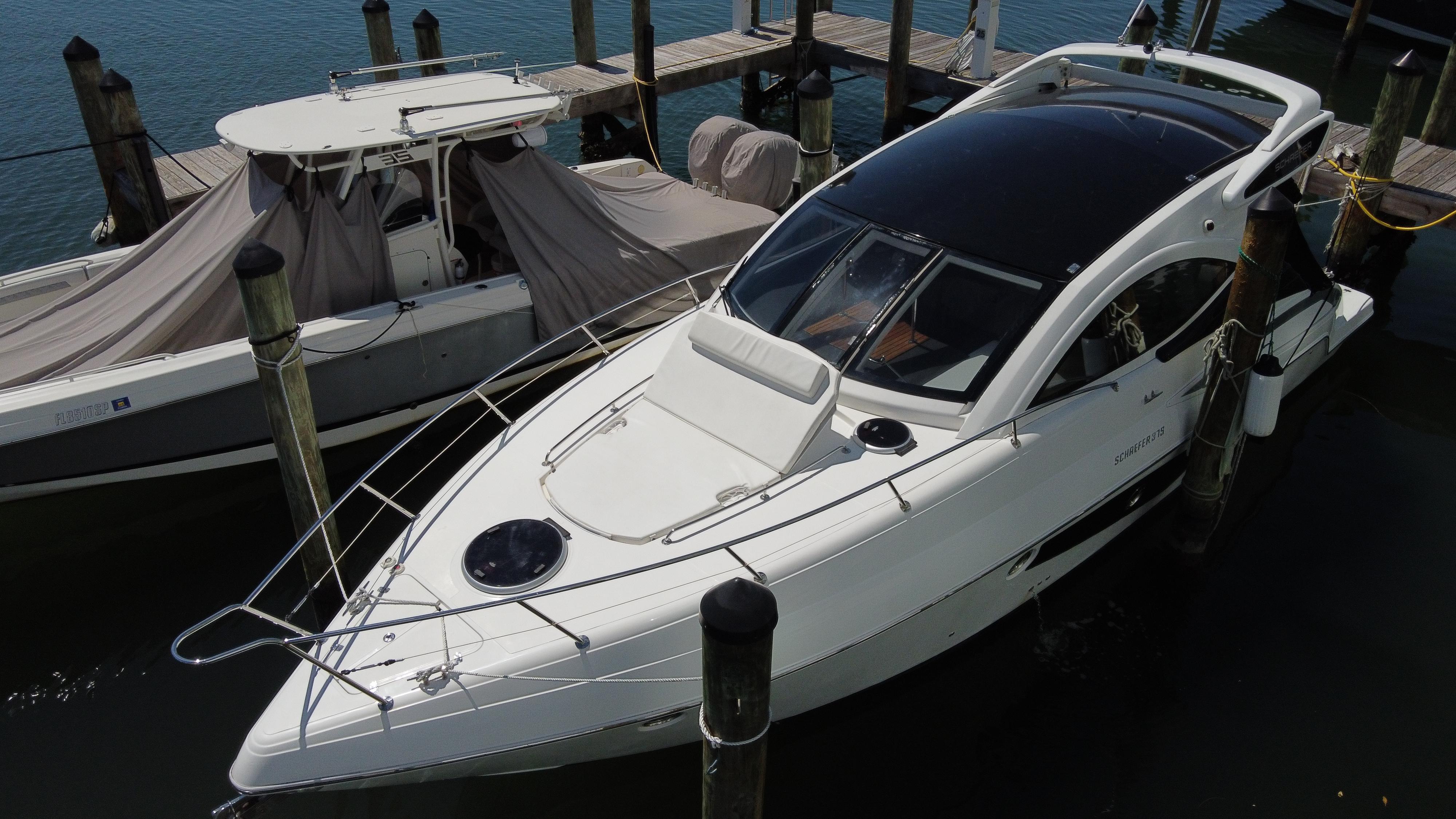 2023 Schaefer 375 HT yacht docked at marina, sleek design, white exterior.