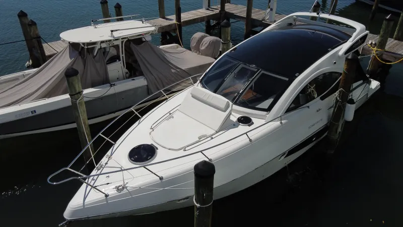  Yacht Photos Pics 2023 Schaefer 375 HT yacht docked at marina, sleek design, white exterior.