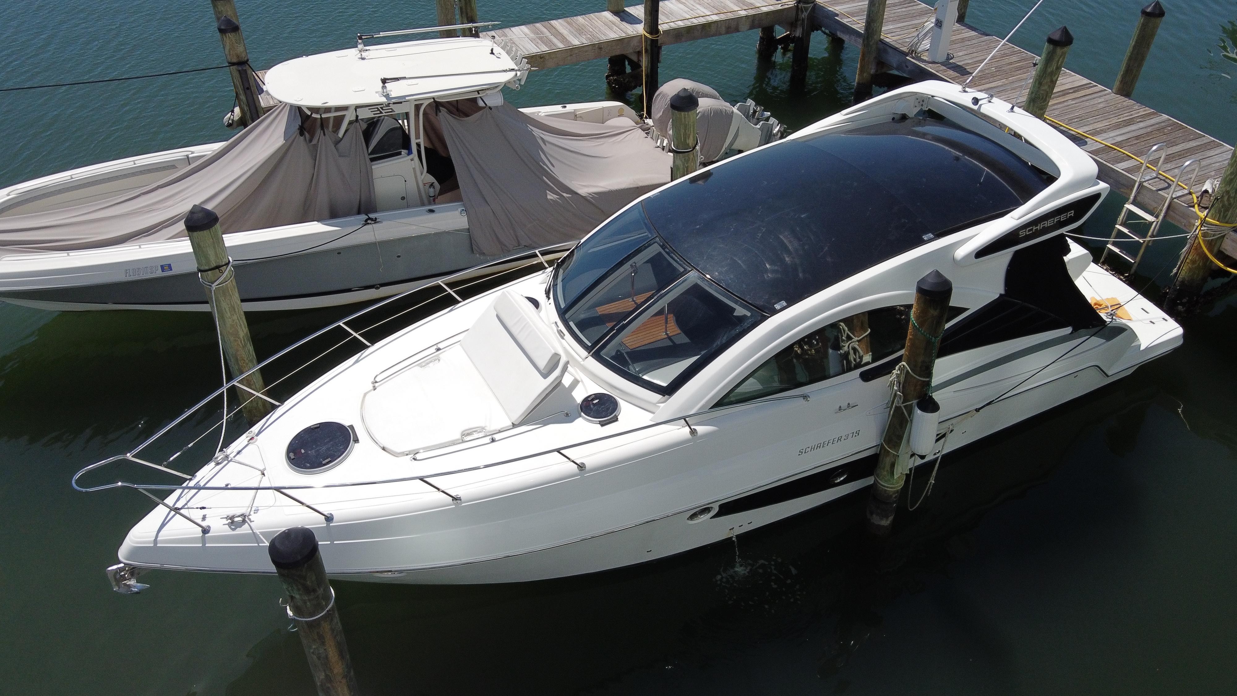 2023 Schaefer 375 HT yacht docked at marina, aerial view.