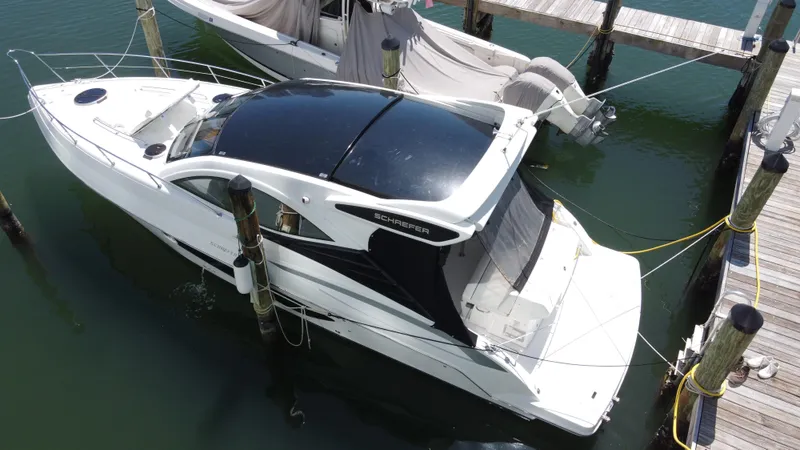  Yacht Photos Pics 2023 Schaefer 375 HT yacht docked at marina, aerial view.