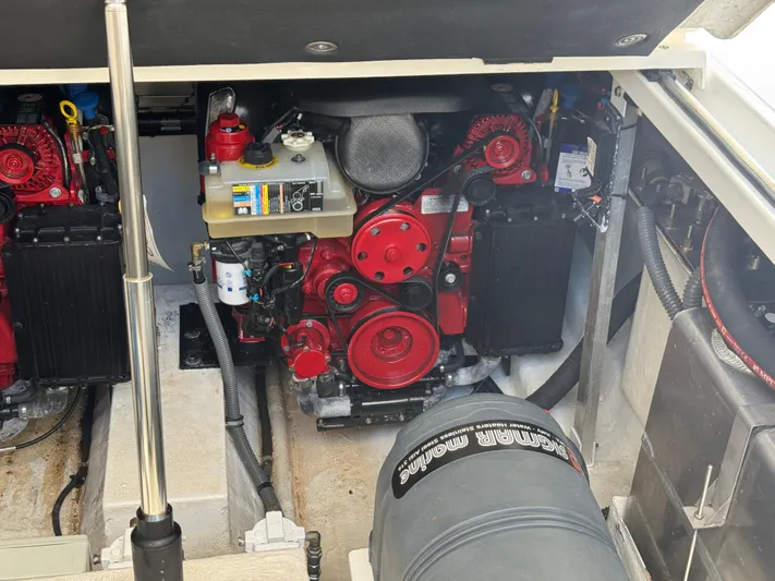 Yacht Photos Pics Engine compartment of 2023 Schaefer 375 HT boat, showcasing red engine components.
