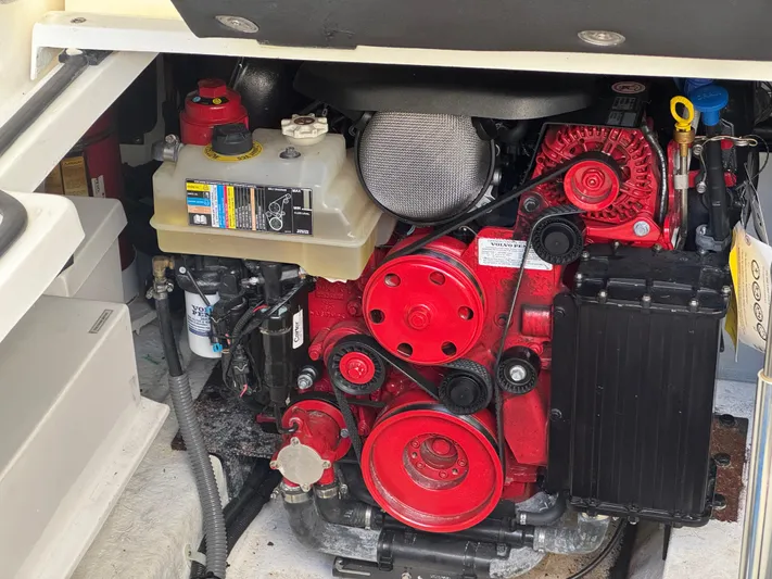  Yacht Photos Pics Engine compartment of 2023 Schaefer 375 HT boat, featuring red components and fluid reservoirs.