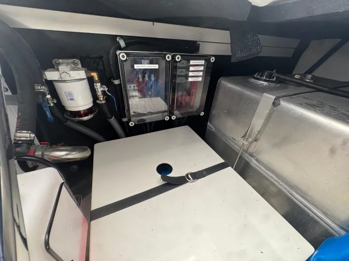  Yacht Photos Pics Engine compartment of 2023 Schaefer 375 HT boat, featuring fuel system and storage components.