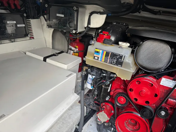  Yacht Photos Pics Engine compartment of 2023 Schaefer 375 HT boat, featuring red components and safety equipment.