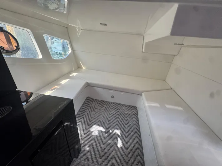  Yacht Photos Pics Interior of 2023 Schaefer 375 HT yacht with modern design and chevron-patterned carpet.
