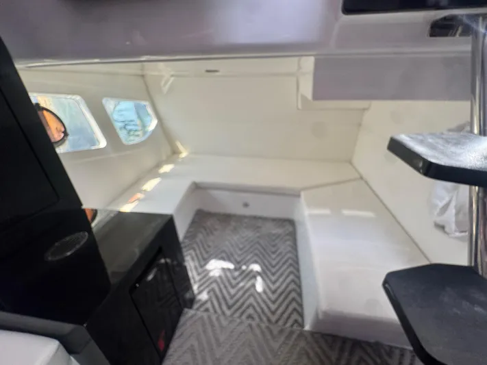  Yacht Photos Pics 2023 Schaefer 375 HT cabin interior with modern design and chevron-patterned flooring.