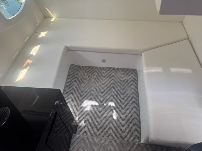  Yacht Photos Pics Interior of 2023 Schaefer 375 HT yacht with modern seating and patterned flooring.