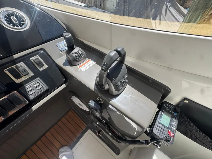  Yacht Photos Pics Control panel of 2023 Schaefer 375 HT yacht with modern navigation equipment.