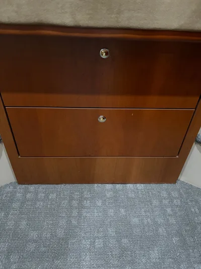 White Lightning Yacht Photos Pics Wooden cabinet with two drawers inside a 2003 Cruisers Yachts 4270 Express.