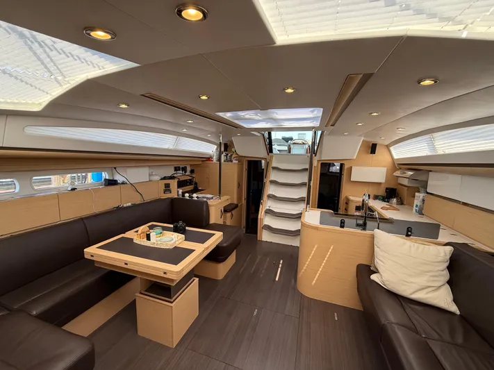 Padraigin II Yacht Photos Pics Luxurious interior of 2016 Jeanneau Yachts 58 with modern furnishings and ample natural light.