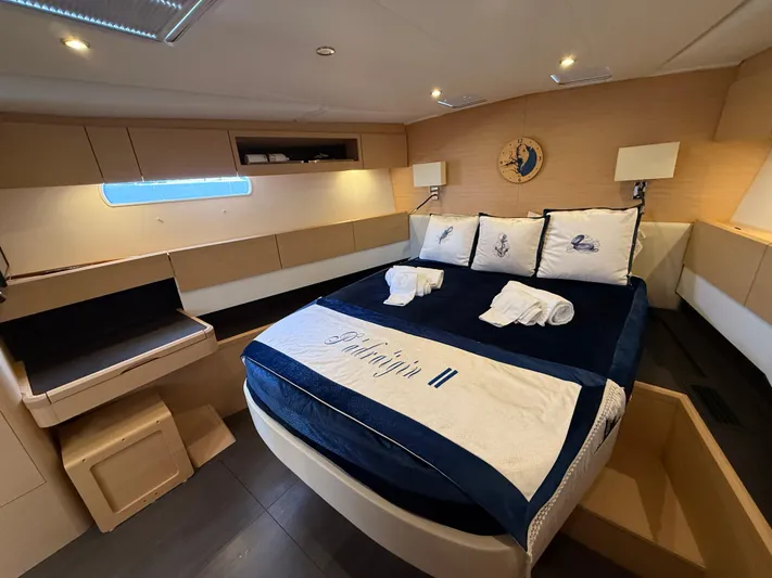 Padraigin II Yacht Photos Pics Luxurious cabin interior of 2016 Jeanneau Yachts 58 with elegant bedding and modern design.