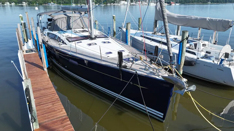 Padraigin II Yacht Photos Pics 2016 Jeanneau Yachts 58 docked at marina, sleek design, calm water, sunny day.