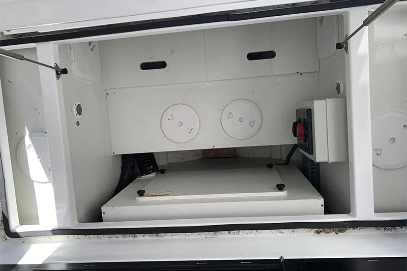  Yacht Photos Pics 2023 Beneteau Antares 9 storage compartment with mechanical components and wiring.