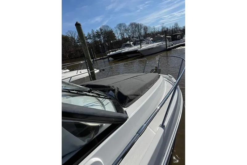  Yacht Photos Pics 2023 Beneteau Antares 9 docked, showcasing sleek design and modern features.