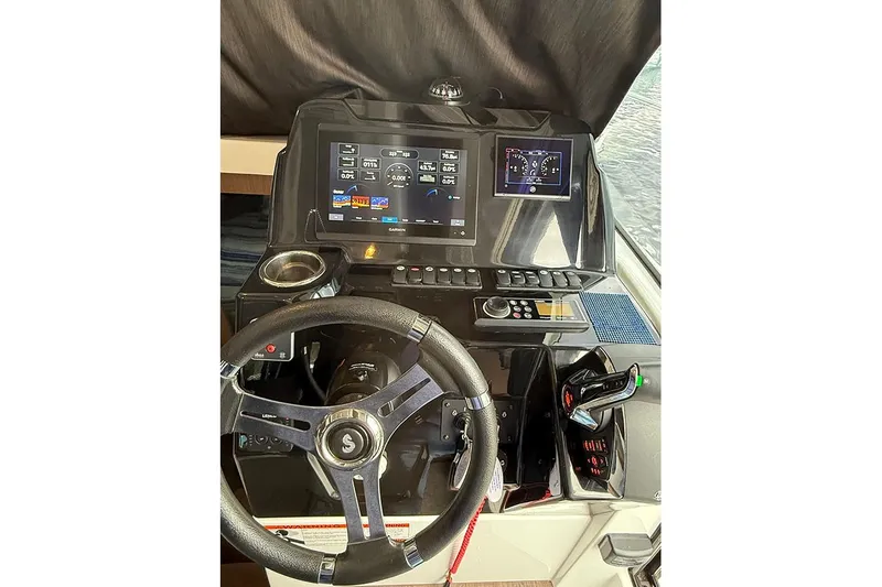  Yacht Photos Pics 2023 Beneteau Antares 9 helm with modern navigation displays and controls.