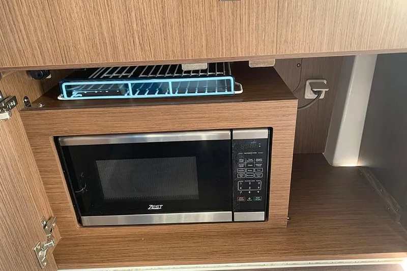  Yacht Photos Pics Microwave in 2023 Beneteau Antares 9 boat kitchen cabinet.