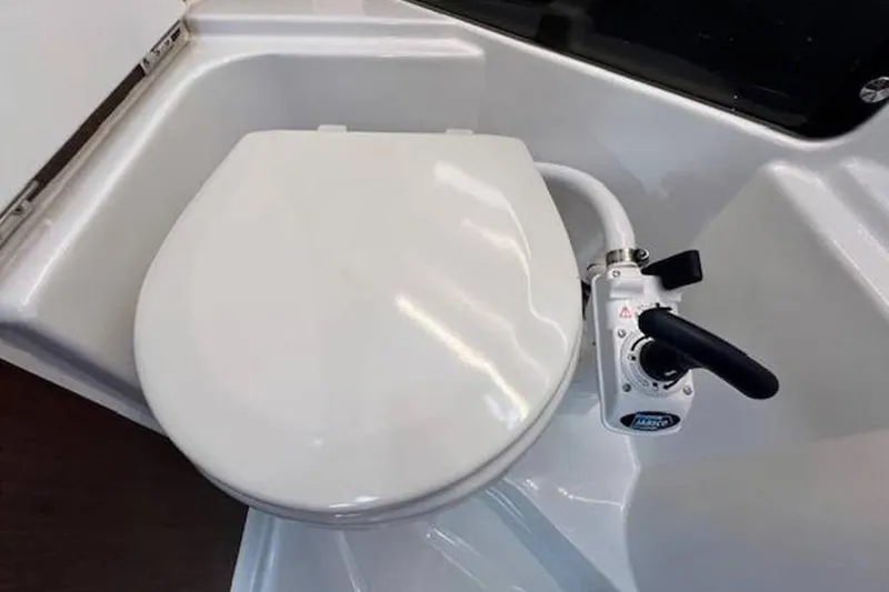  Yacht Photos Pics 2023 Beneteau Antares 9 marine toilet with manual flush system.