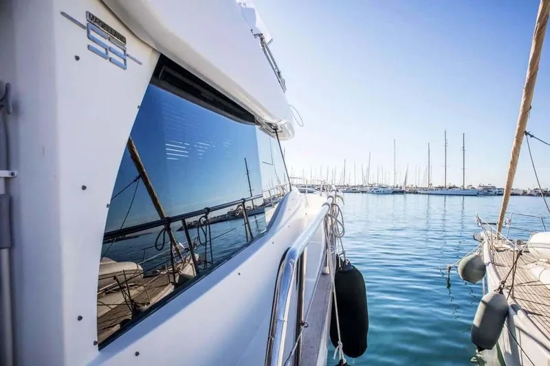 Obsession Yacht Photos Pics Azimut Magellano 53 yacht, 2015 model, docked in a sunny marina.