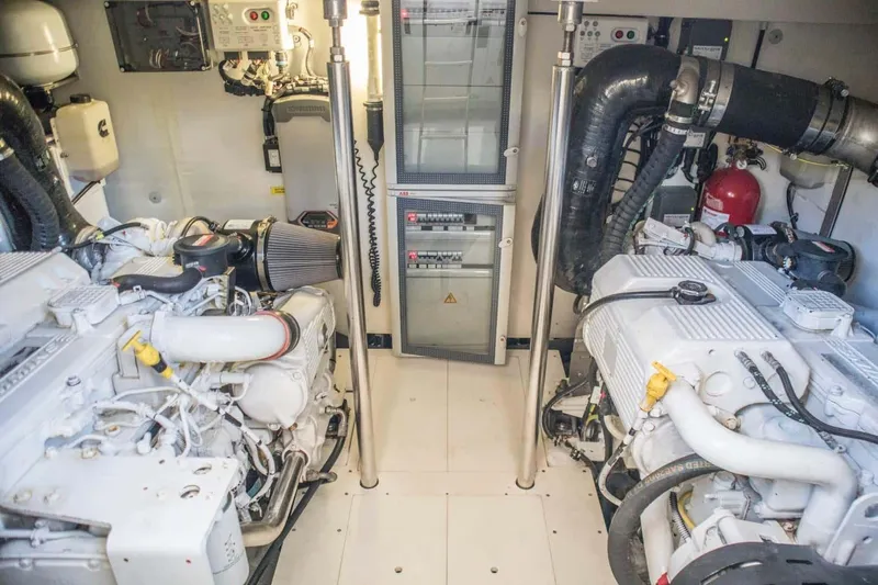 Obsession Yacht Photos Pics Engine room of 2015 Azimut Magellano 53 yacht, featuring dual engines and technical equipment.