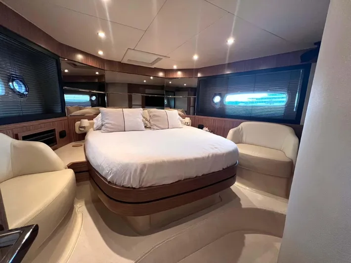 Obsession Yacht Photos Pics Luxurious bedroom interior of 2015 Azimut Magellano 53 yacht with modern furnishings.