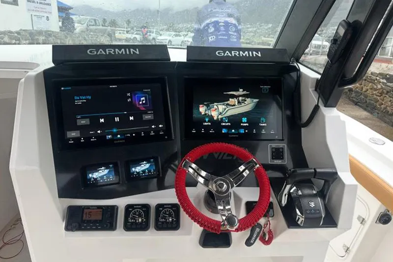  Yacht Photos Pics Dashboard of 2026 MVI Invicta 30CC boat with Garmin navigation displays.