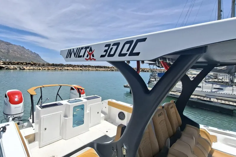  Yacht Photos Pics 2026 MVI Invicta 30CC boat docked, featuring sleek design and powerful engines.
