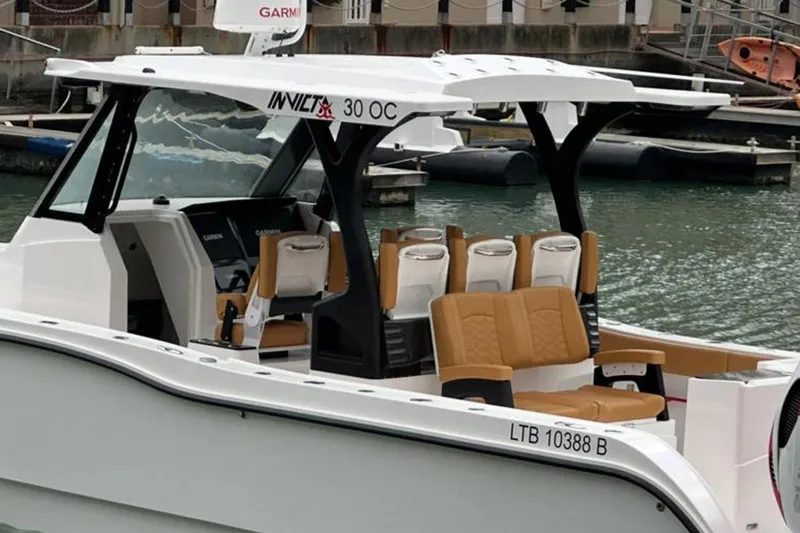  Yacht Photos Pics 2026 MVI Invicta 30CC boat with tan seats docked in marina.