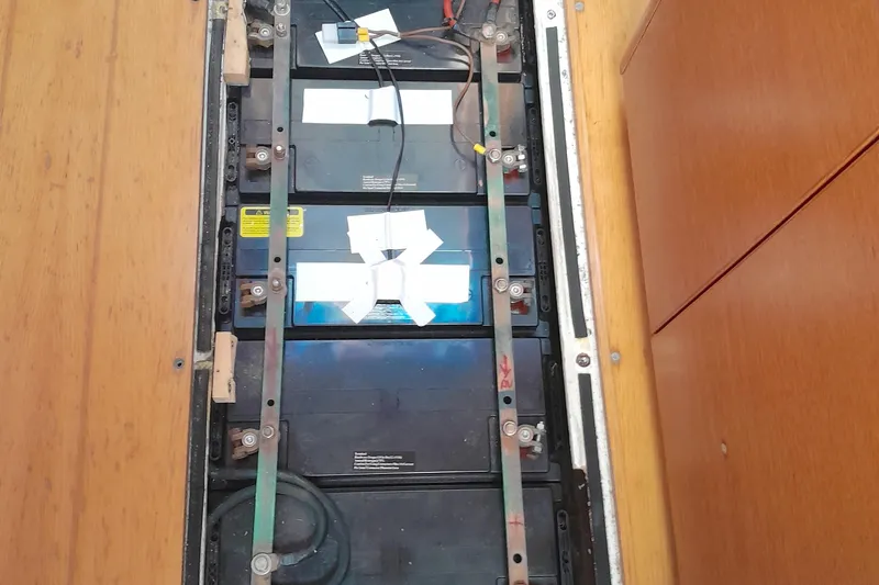  Yacht Photos Pics Battery compartment of a 2010 Grand Soleil 54 yacht, showcasing electrical connections.