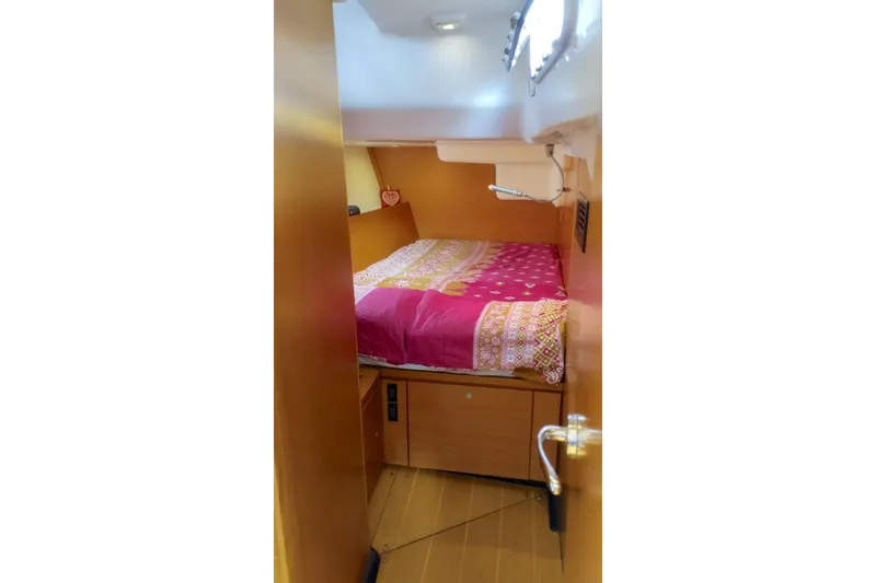  Yacht Photos Pics Cozy cabin interior of 2010 Grand Soleil 54 yacht with colorful bedding.