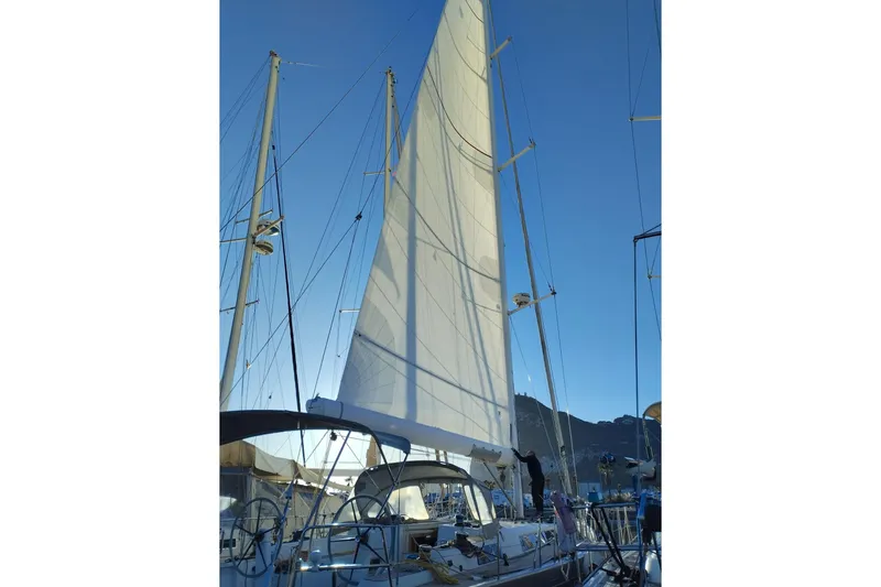  Yacht Photos Pics Sailing yacht Grand Soleil 54, 2010 model, with raised sails against a clear blue sky.