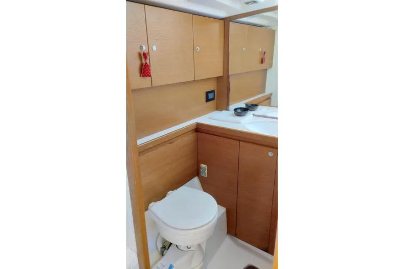  Yacht Photos Pics Bathroom interior of 2010 Grand Soleil 54 yacht with wooden cabinetry.