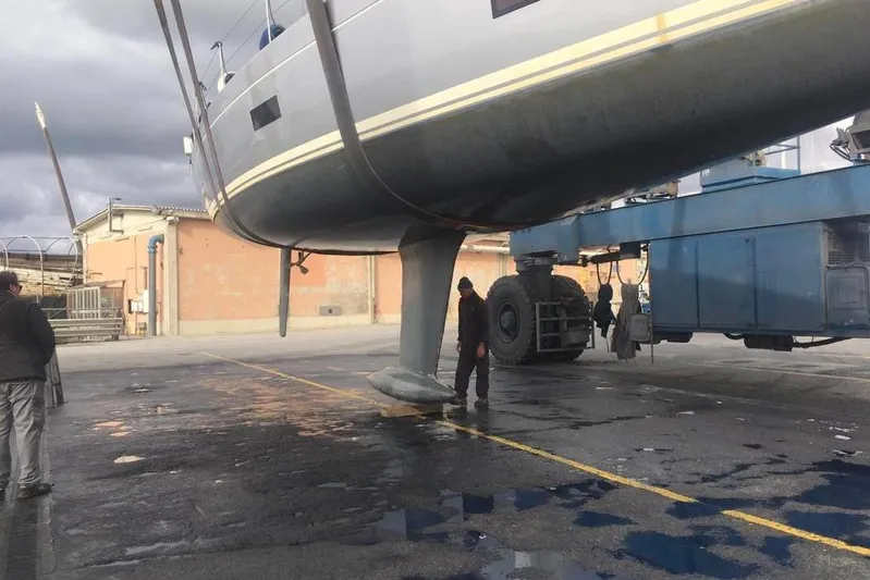  Yacht Photos Pics Grand Soleil 54 yacht from 2010 being lifted by a large crane.