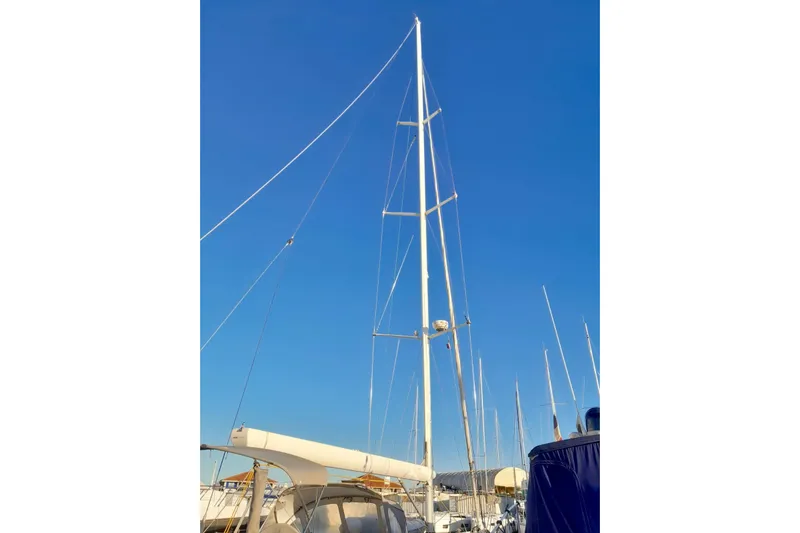  Yacht Photos Pics Sailboat mast of 2010 Grand Soleil 54 against clear blue sky.