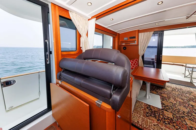 Gotali Yacht Photos Pics Interior of 2016 Beneteau Swift Trawler 44, featuring elegant wood finishes and ocean view.