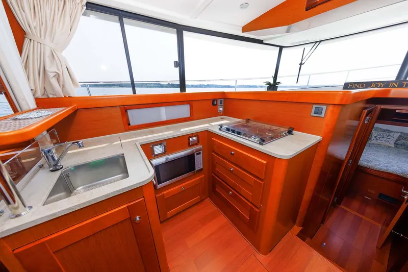 Gotali Yacht Photos Pics 2016 Beneteau Swift Trawler 44 kitchen with modern appliances and ocean view.