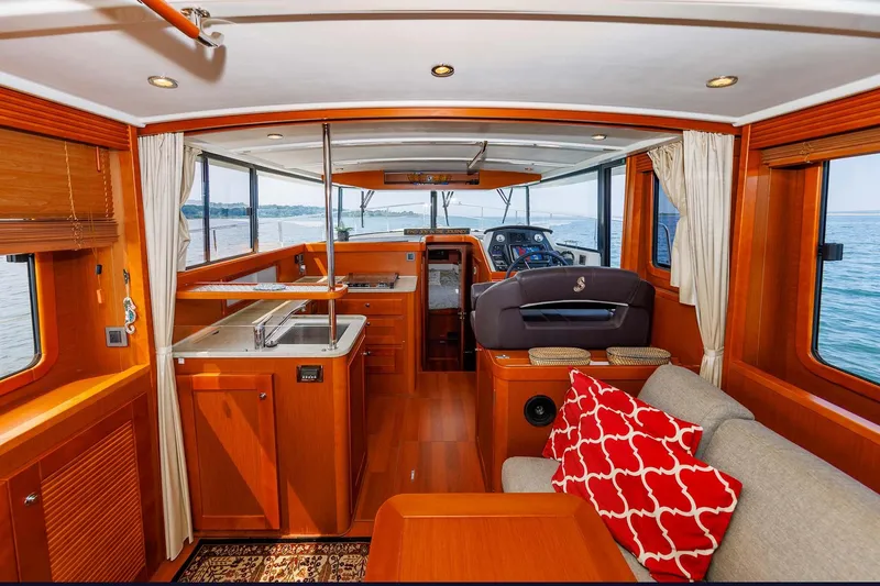 Gotali Yacht Photos Pics 2016 Beneteau Swift Trawler 44 interior with modern kitchen, cozy seating, and ocean view.