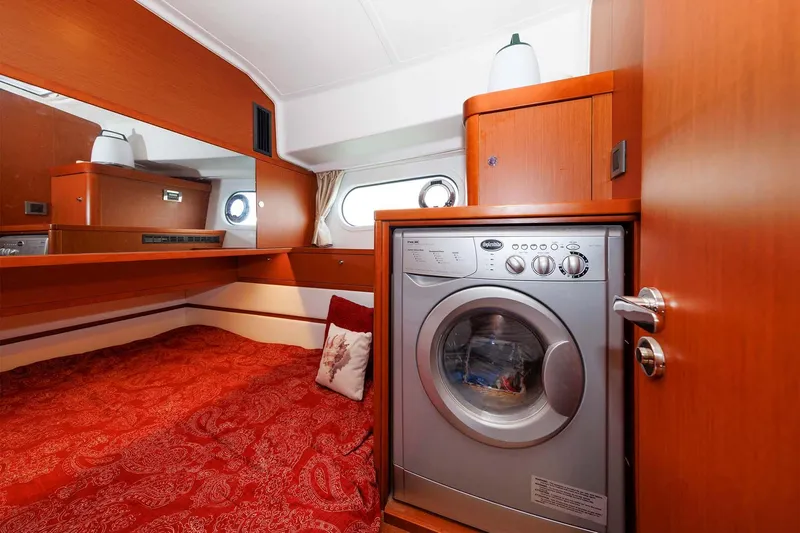 Gotali Yacht Photos Pics 2016 Beneteau Swift Trawler 44 interior with bed and washing machine.