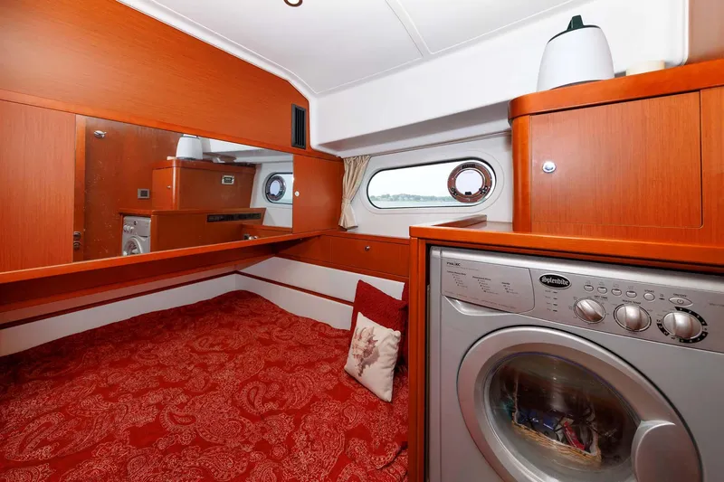 Gotali Yacht Photos Pics Interior of 2016 Beneteau Swift Trawler 44 with bed and washing machine.