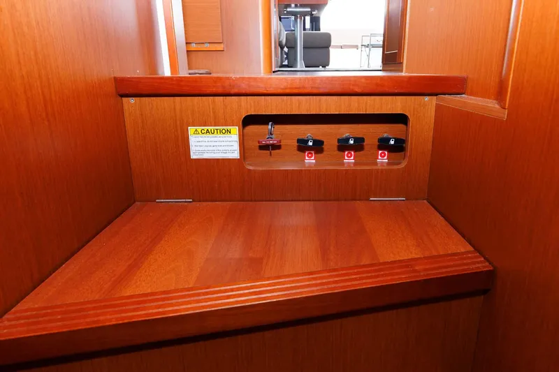 Gotali Yacht Photos Pics 2016 Beneteau Swift Trawler 44 interior with control panel and wooden finish.